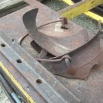 33. Metal boiler pot with leg (in pieces), resting on #31 flatcar.