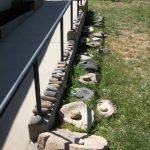 46. (Behind depot and adjacent to Section House ramp) - collection of American Indian matates (large flat grinding stones, and manos (small stones) used for grinding grain and grass seeds.
